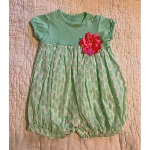 Green onesie with pink flower